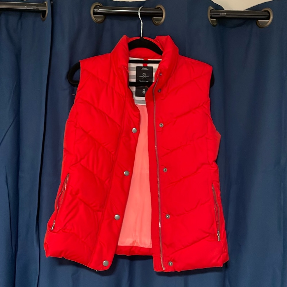 Super cute XS hot red light puffer vest from GAP. Slightly worn but looks new.